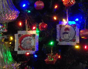 Santa Ornament with Frosty the Snowman on a Christmas Tree